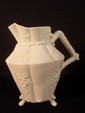 Belleek three footed Cherry Blossom decorated pitcher, first black mark 7